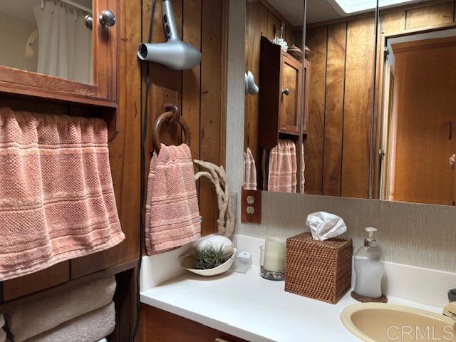 170 Diana Street, Unit 24 Encinitas, CA 92024 - Photo 24 of 26 a bathroom with a sink and a mirror