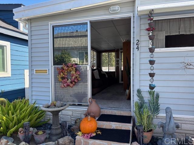 170 Diana Street, Unit 24 Encinitas, CA 92024 - Photo 4 of 26 a front view of a house with outdoor seating