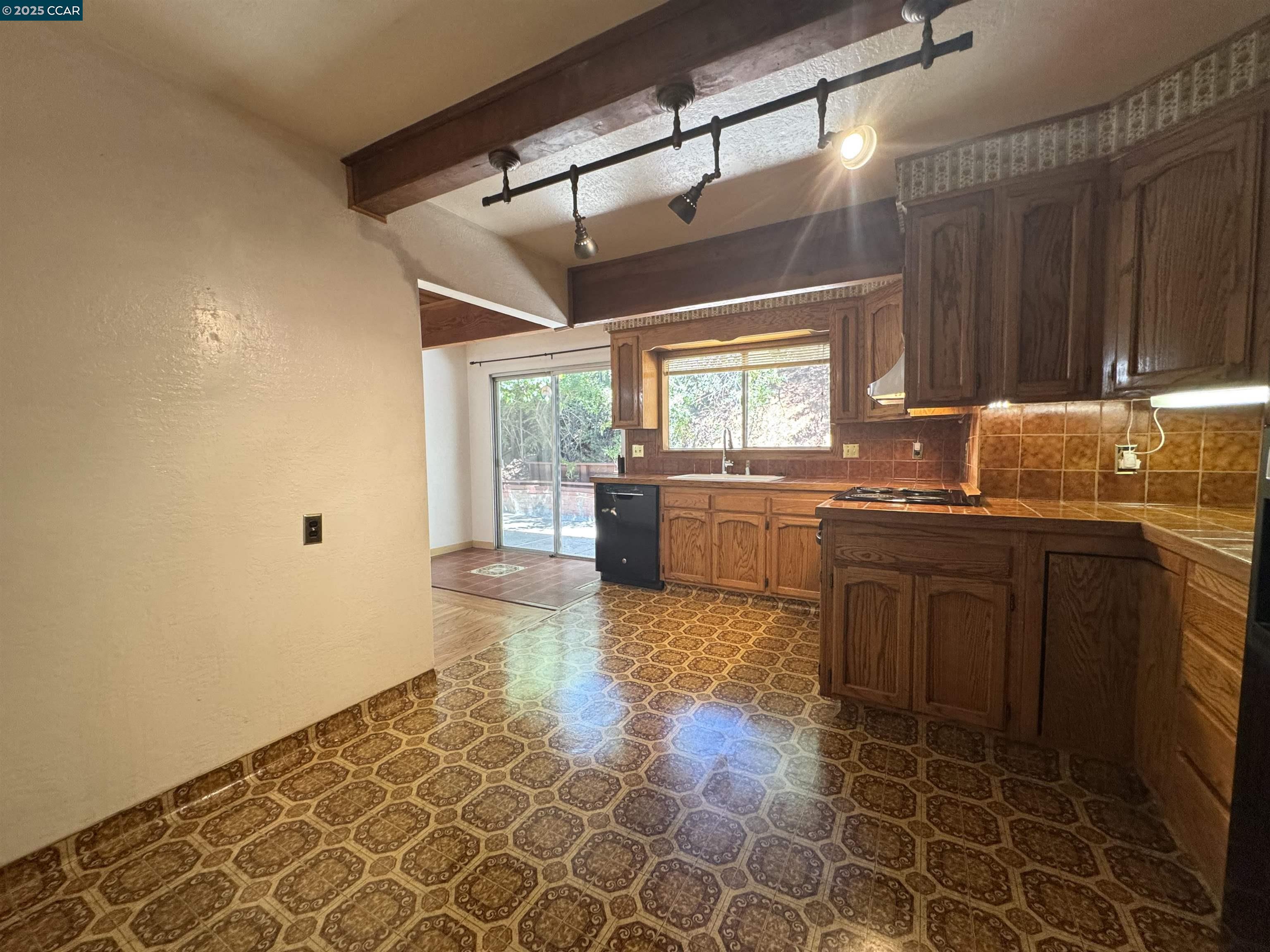 919 Janet Lane Lafayette, CA 94549 - Photo 12 of 29 a kitchen with granite countertop a sink and a stove top oven