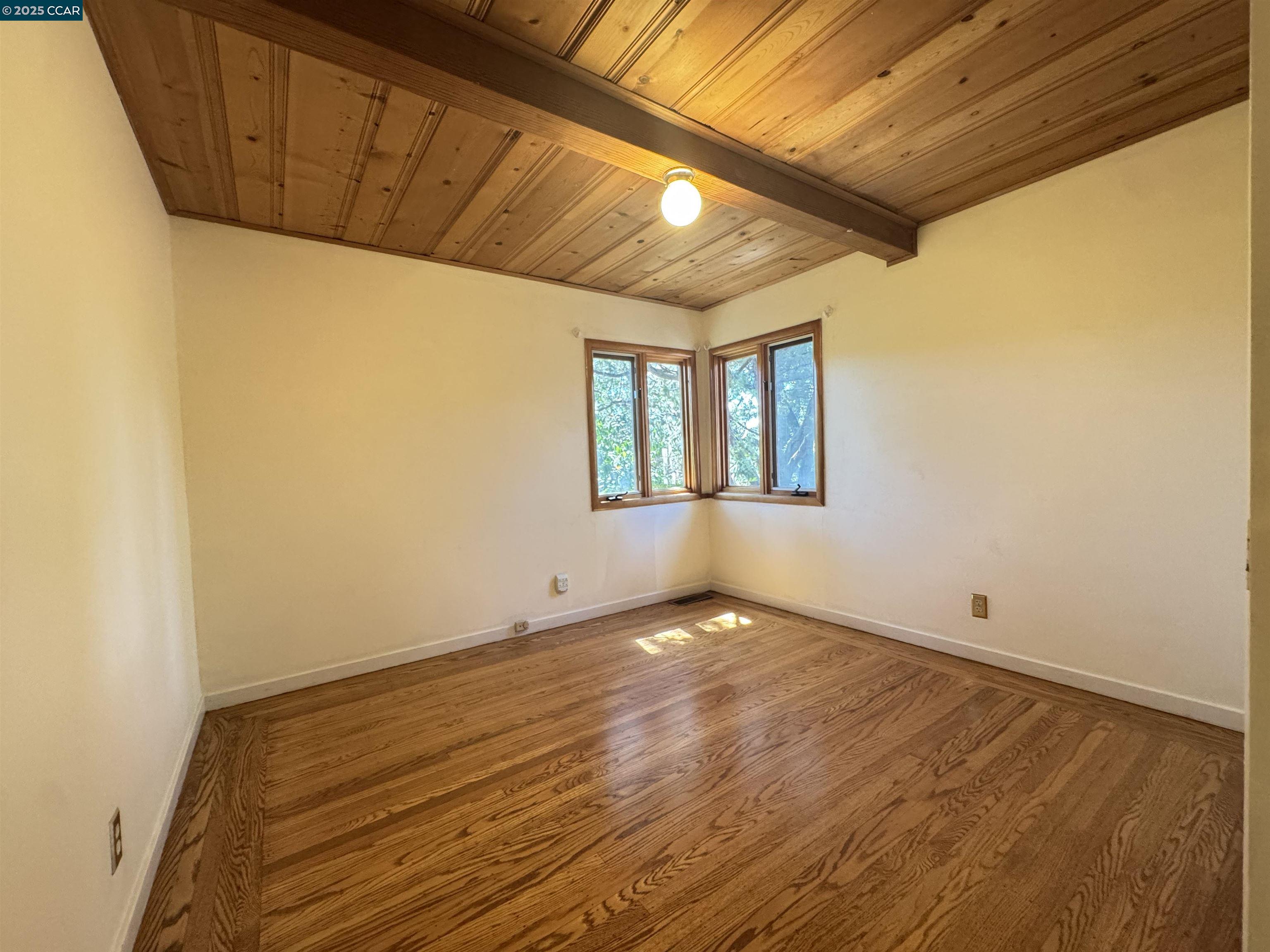 919 Janet Lane Lafayette, CA 94549 - Photo 15 of 29 a view of an empty room with wooden floor