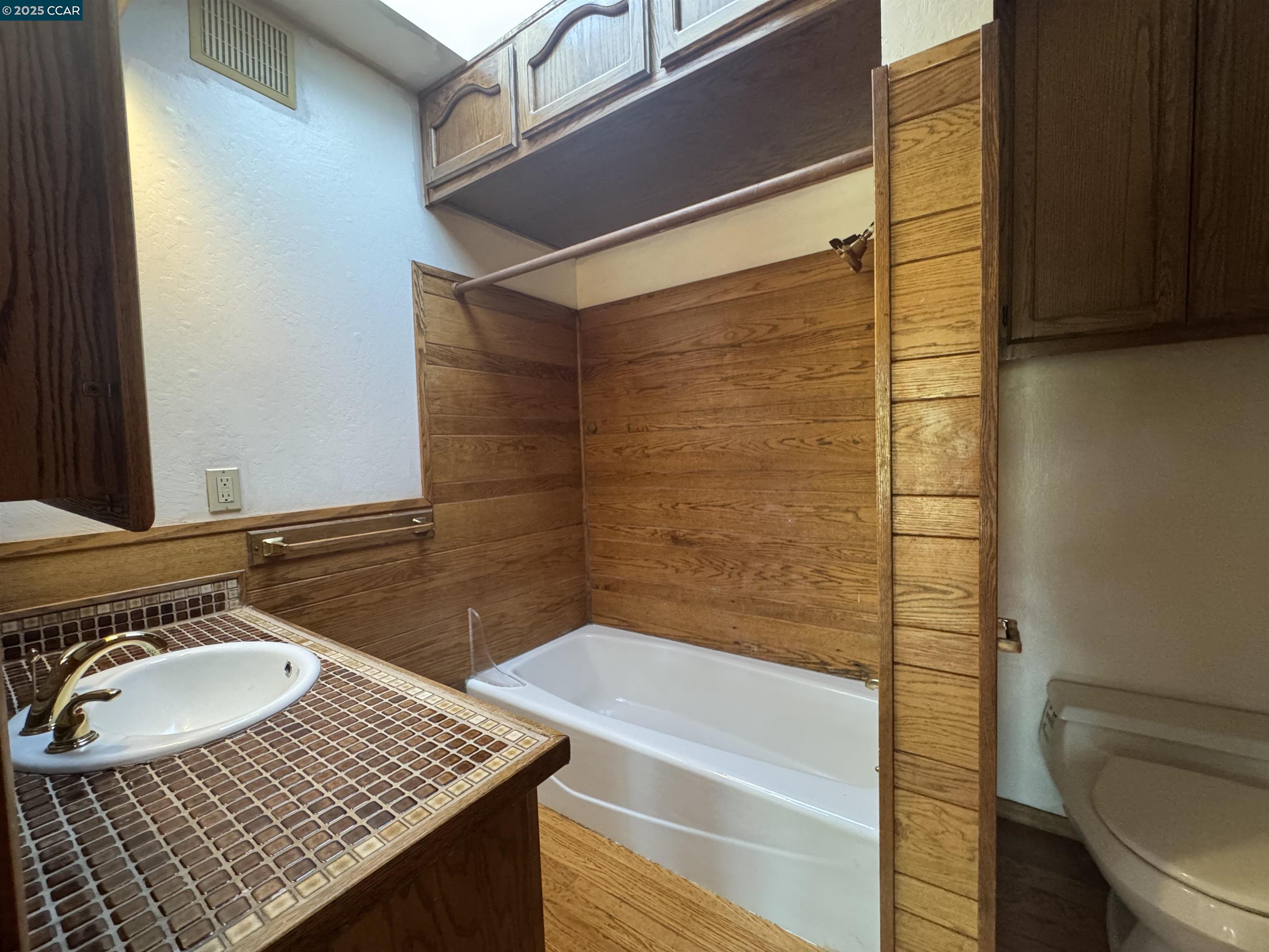 919 Janet Lane Lafayette, CA 94549 - Photo 17 of 29 a bathroom with a granite countertop sink and a mirror