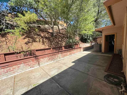a view of outdoor space with deck and tree