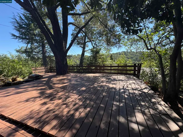 a view of backyard with wooden floor