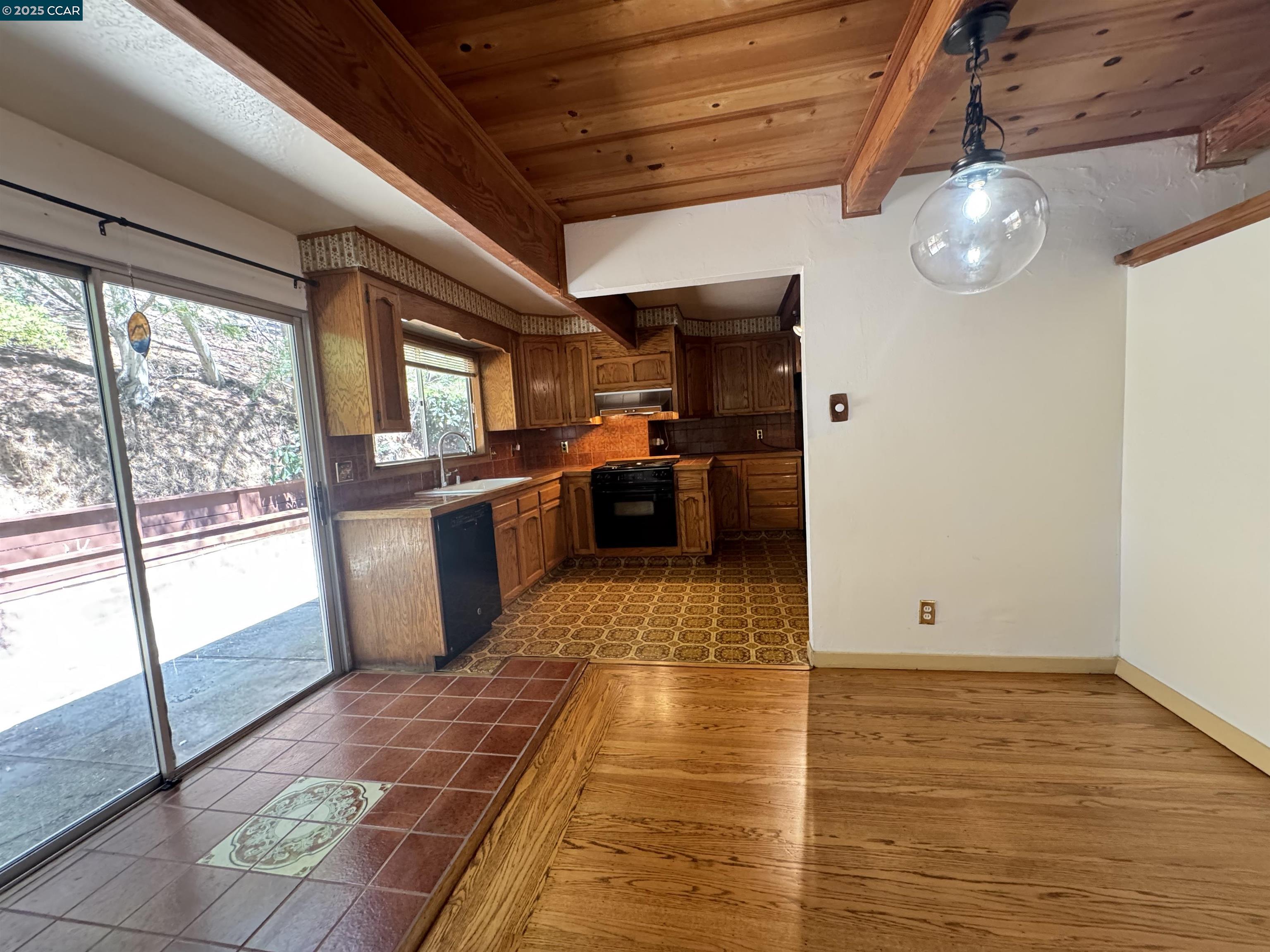 919 Janet Lane Lafayette, CA 94549 - Photo 8 of 29 a view of a kitchen with a sink and wooden floor
