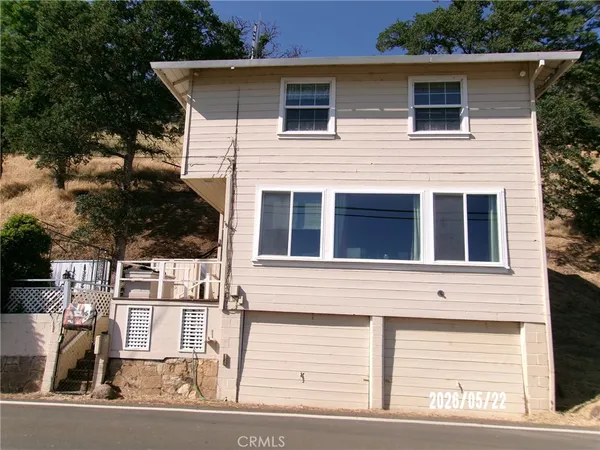 a front view of a house with garage