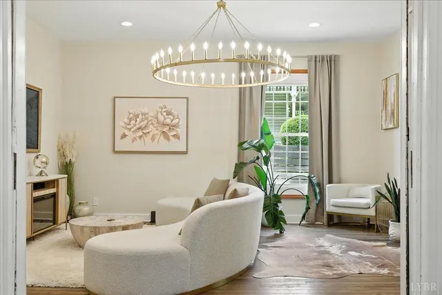 a living room with furniture a piano and a window