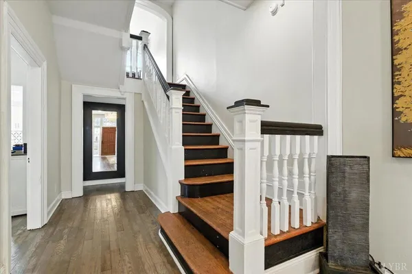 a bedroom with a bed and a ceiling fan