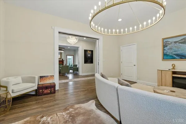 a living room with furniture fireplace and flat screen tv
