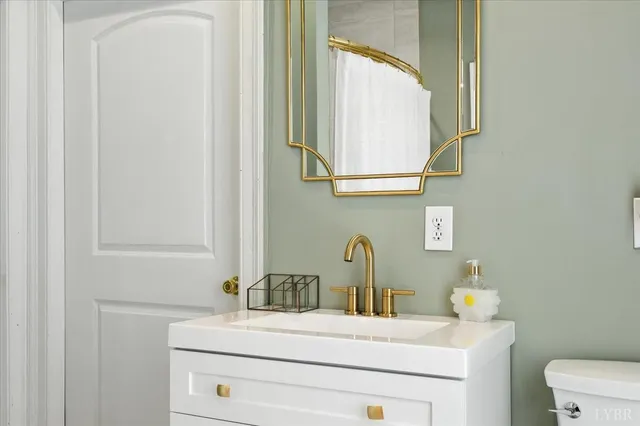 a view of a house with a window and a yard