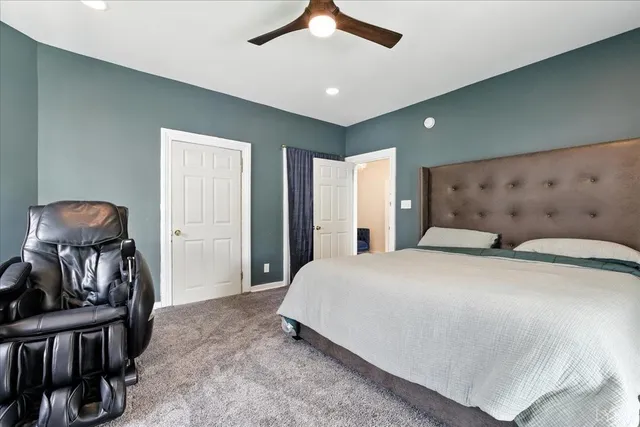 an aerial view of a house with a yard and garden