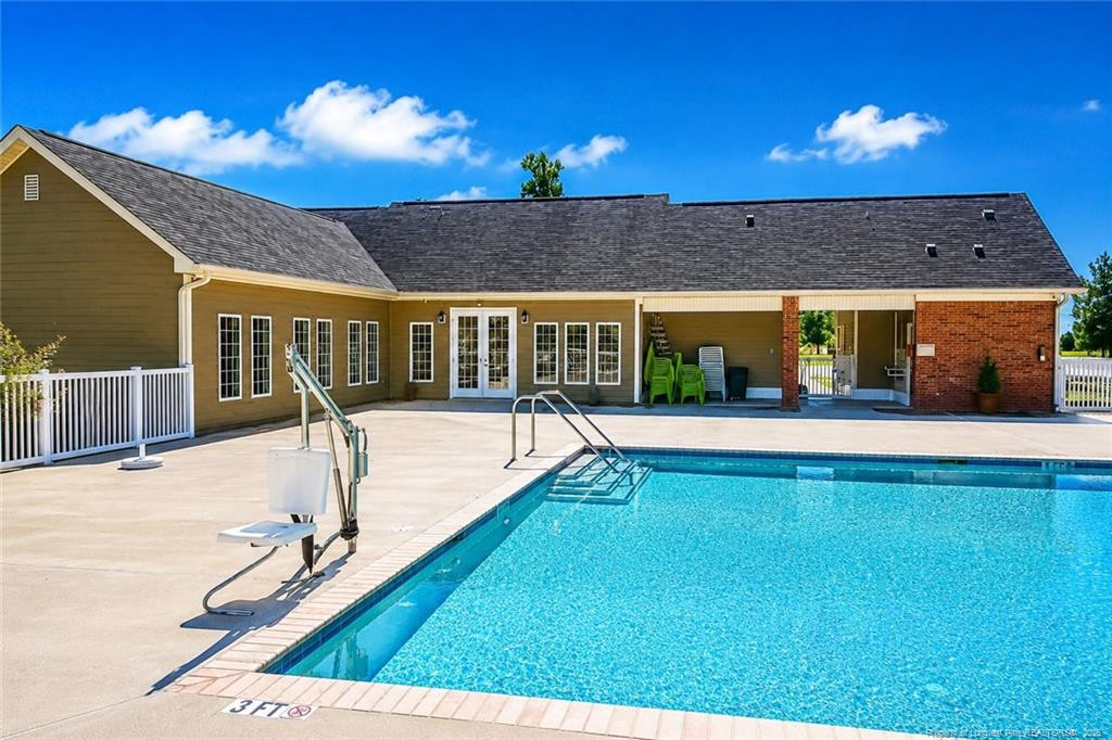 334 Crane Way Bunnlevel, NC 28323 - Photo 42 of 45 a view of a swimming pool with an outdoor seating