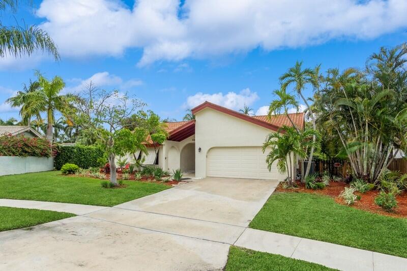 403 Northwest 72nd Street Boca Raton, FL 33487 - Photo 2 of 35 03_403NW72ndSt_571_FrontView_FlexMLS800x