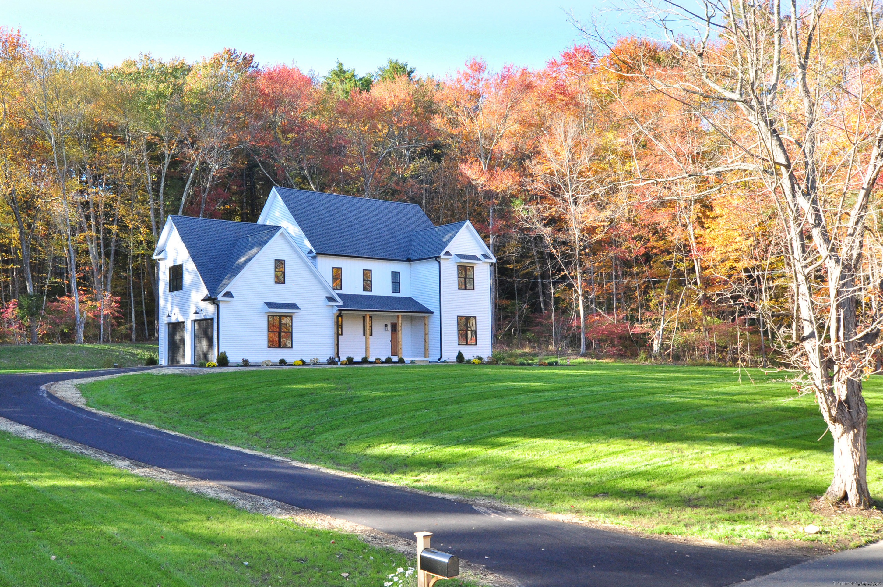 152 East Hill Road Canton, CT 06019 - Photo 18 of 36 a front view of a house with a garden