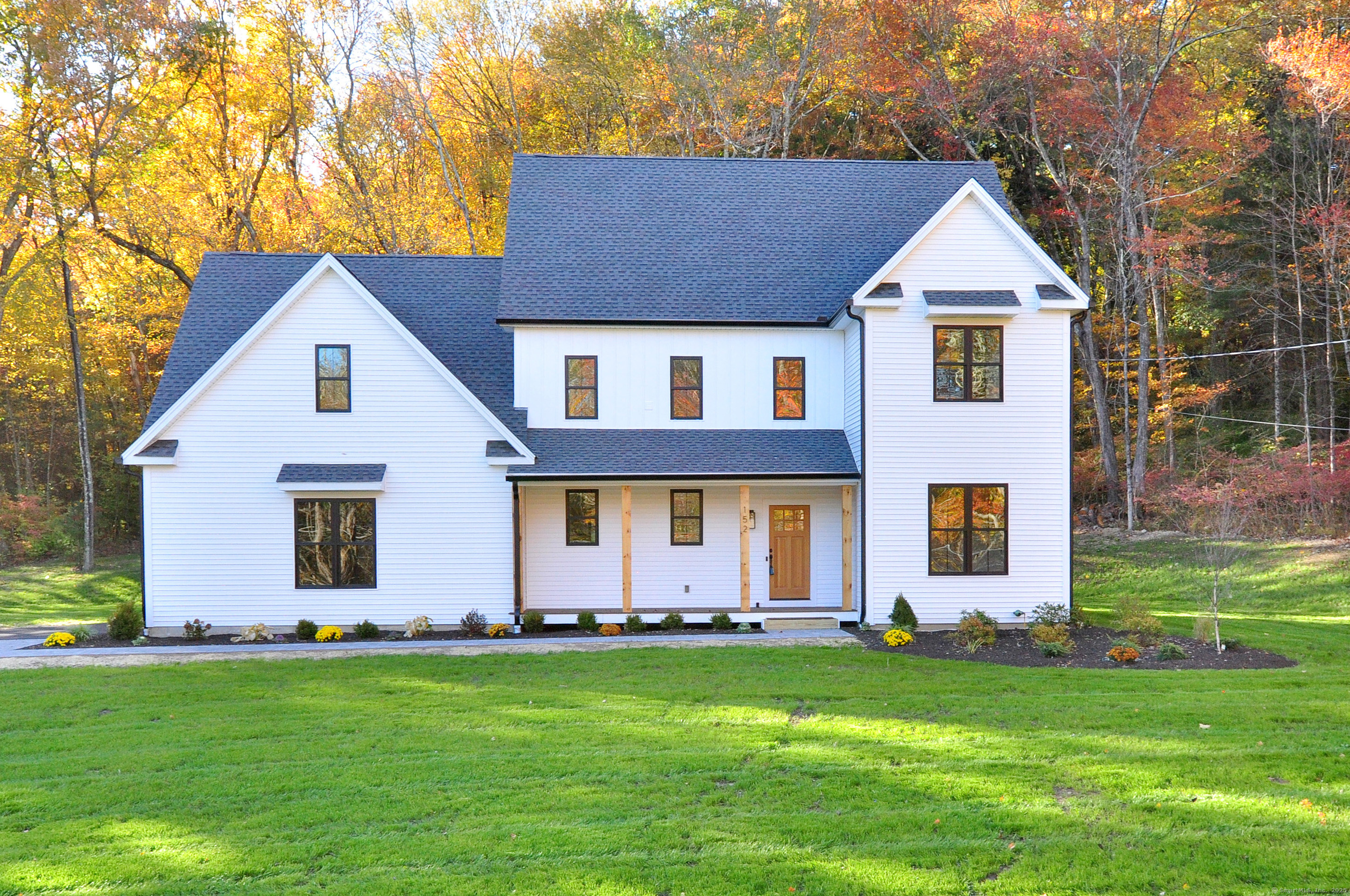 152 East Hill Road Canton, CT 06019 - Photo 19 of 36 a front view of a house with a yard