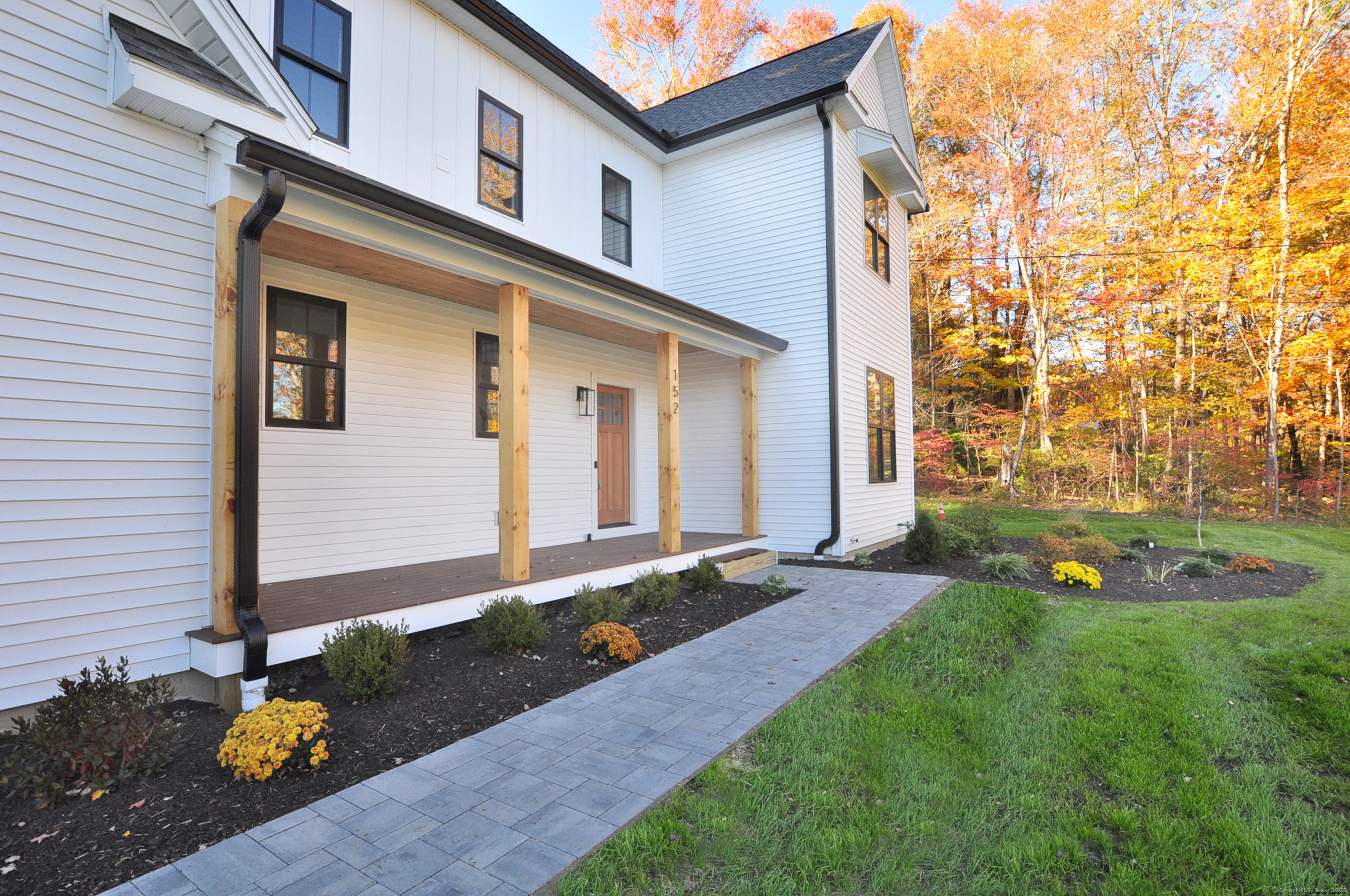 152 East Hill Road Canton, CT 06019 - Photo 22 of 36 a front view of a house with garden