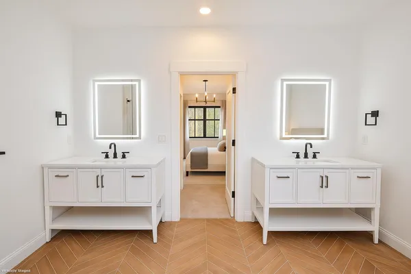 a spacious bedroom with a bed and a table