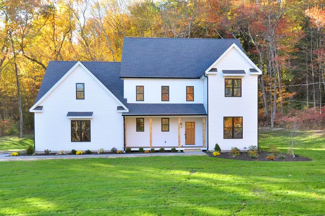 a front view of a house with a yard