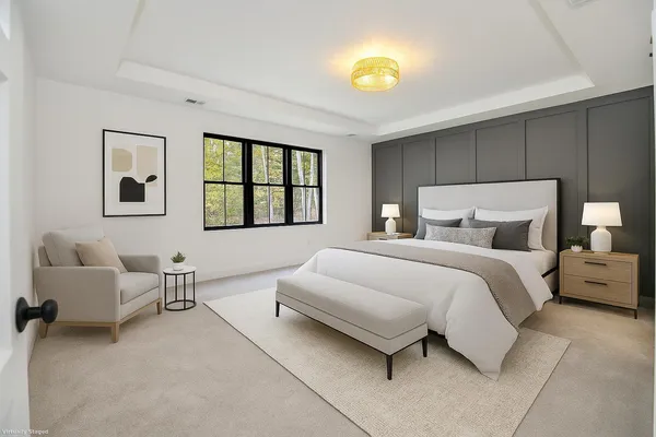 a bedroom with a bed and a couch