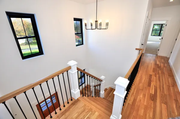 a view of entryway with stairs and wooden floor