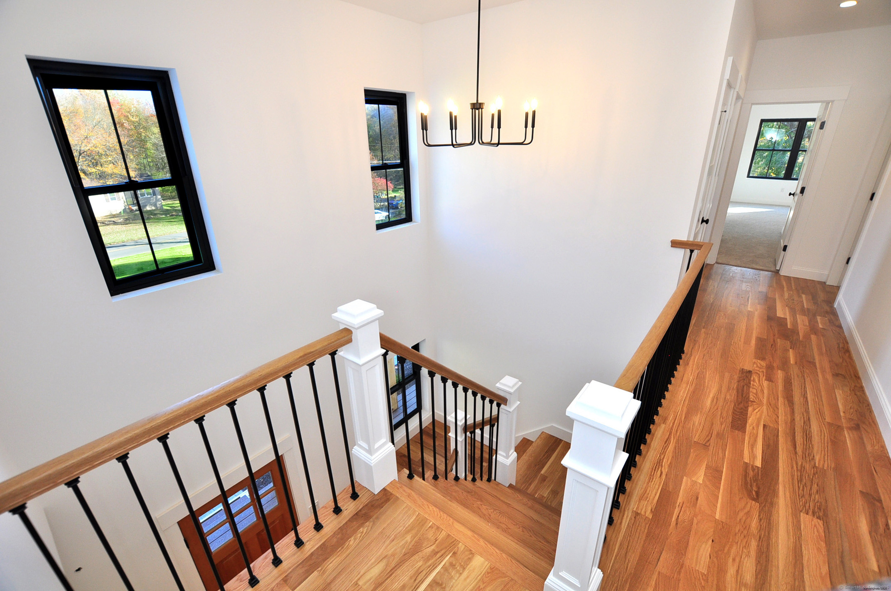 152 East Hill Road Canton, CT 06019 - Photo 5 of 36 a view of entryway with stairs and wooden floor