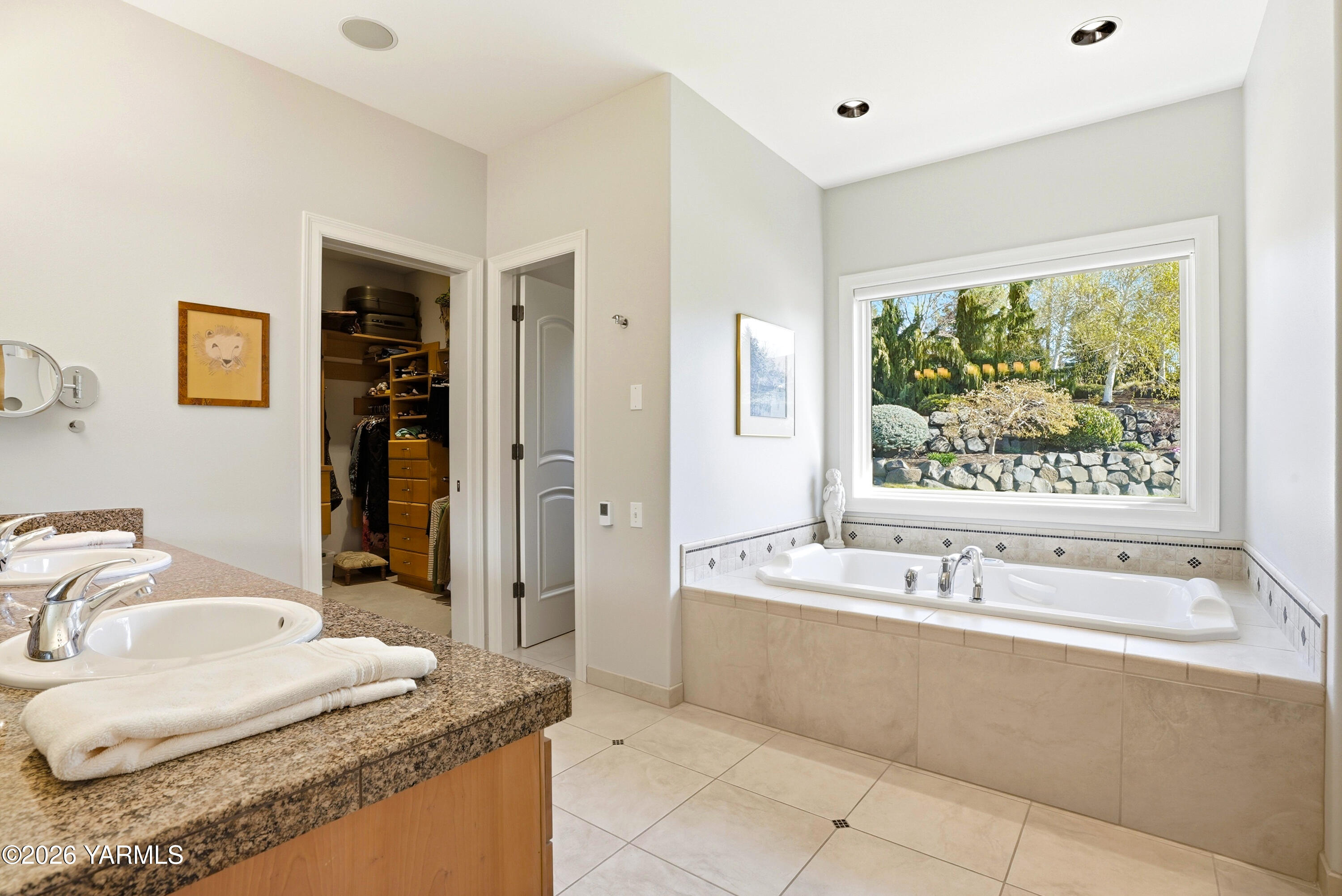 660 Noble Hill Road Yakima, WA 98908 - Photo 23 of 63 a bathroom with a granite countertop tub sink and mirror