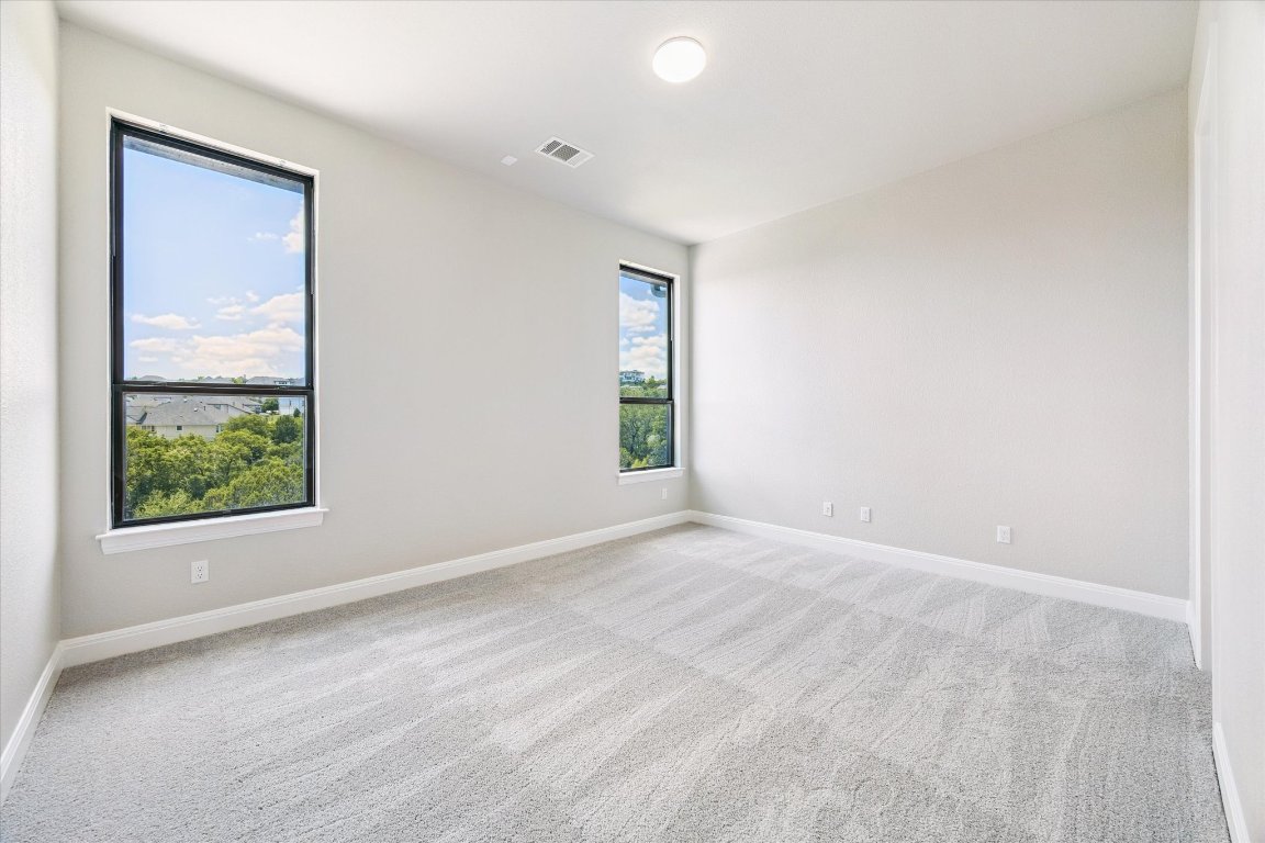 2113 Normandy View Leander, TX 78641 - Photo 14 of 23 an empty room with windows and closet
