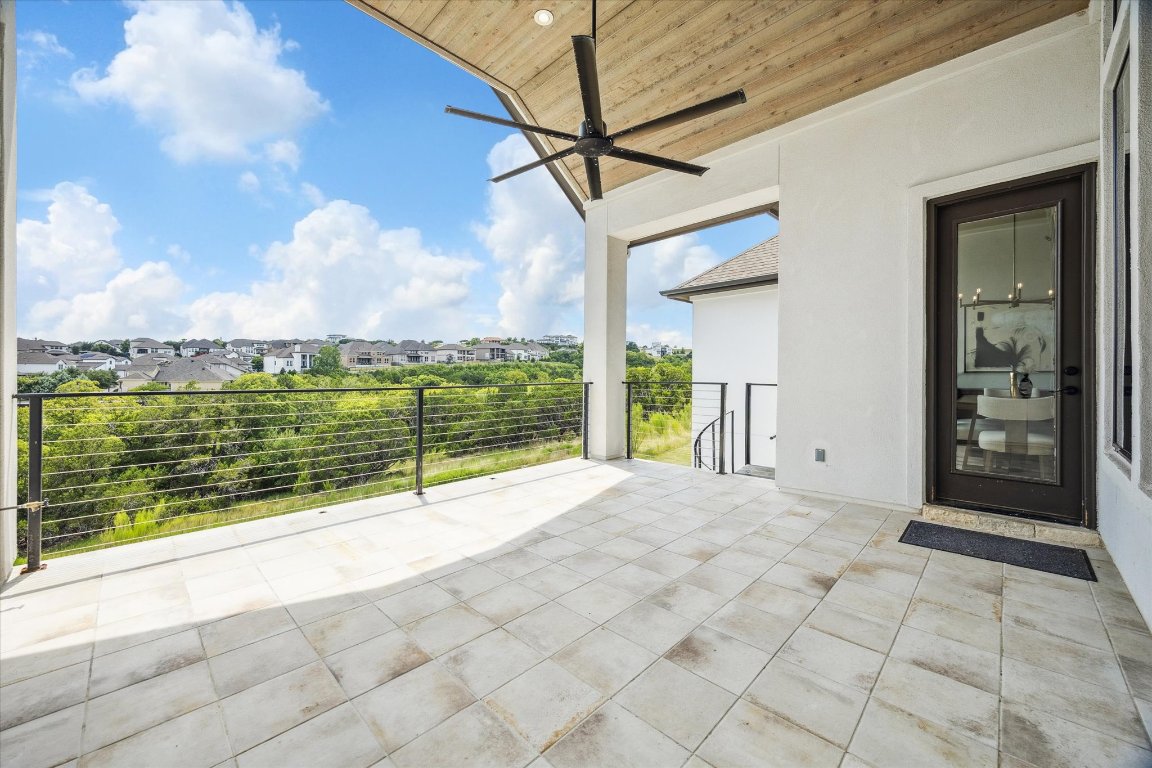 2113 Normandy View Leander, TX 78641 - Photo 20 of 23 a view of a house with a floor to ceiling window next to a yard