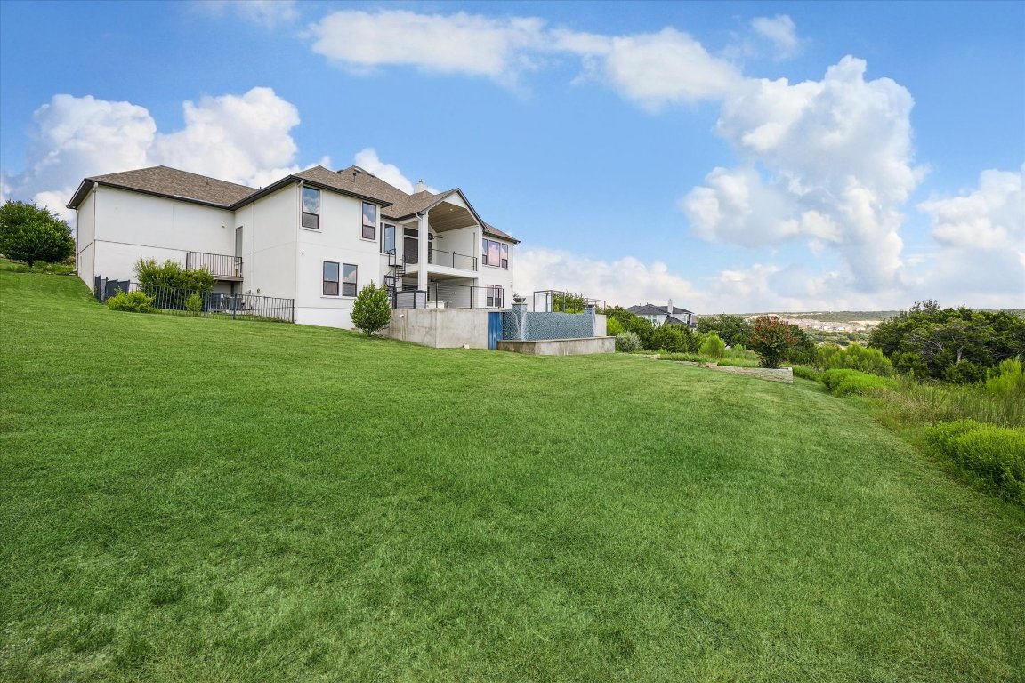 2113 Normandy View Leander, TX 78641 - Photo 23 of 23 a view of a white house with a big yard and large trees