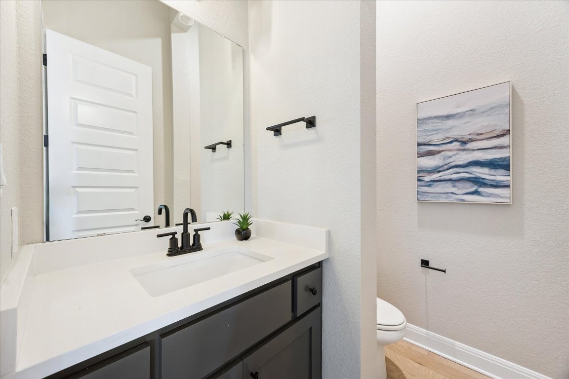 2113 Normandy View Leander, TX 78641 - Photo 9 of 23 a bathroom with a sink and a mirror