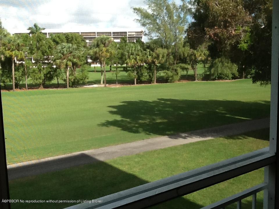 6157 Balboa Circle, Unit 206 Boca Raton, FL 33433 - Photo 2 of 31 a view of a golf course with a garden