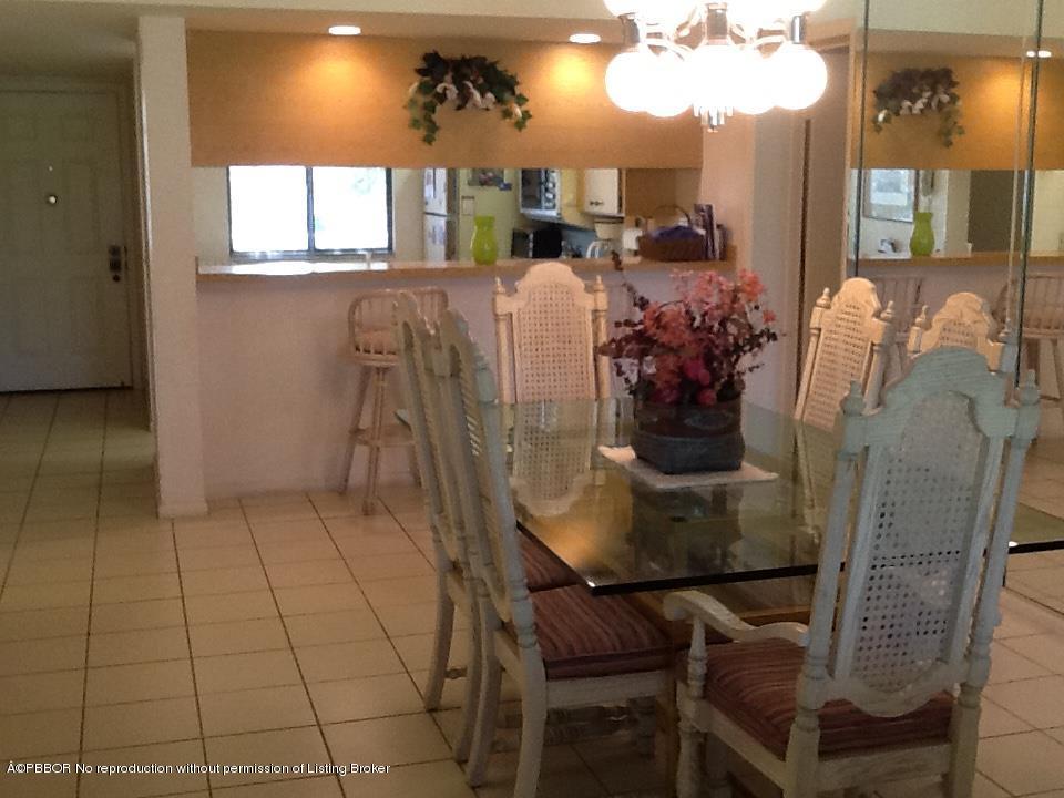 6157 Balboa Circle, Unit 206 Boca Raton, FL 33433 - Photo 11 of 31 a view of a dining room with furniture and window