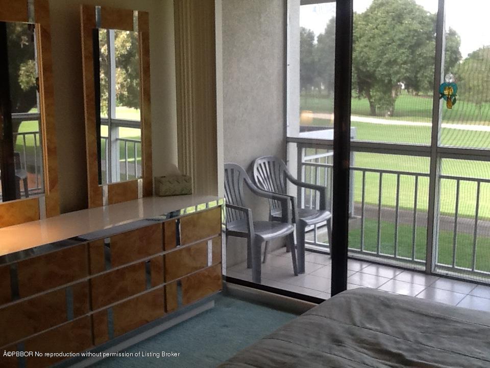 6157 Balboa Circle, Unit 206 Boca Raton, FL 33433 - Photo 24 of 31 a view of front door and deck