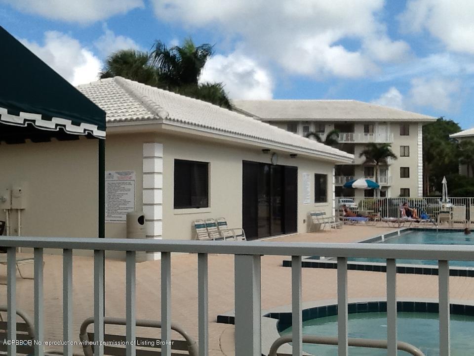 6157 Balboa Circle, Unit 206 Boca Raton, FL 33433 - Photo 27 of 31 a view of a chair and tables in the balcony