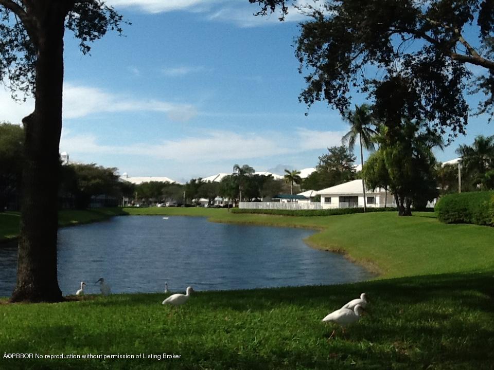 6157 Balboa Circle, Unit 206 Boca Raton, FL 33433 - Photo 29 of 31 an aerial view of a house with a garden and lake view