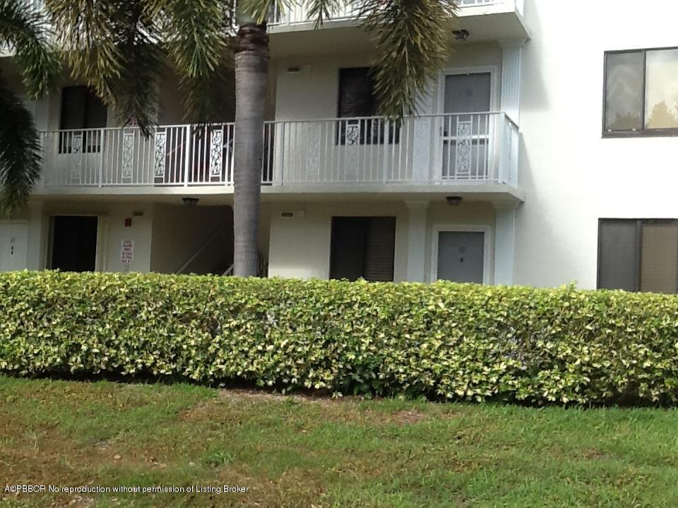6157 Balboa Circle, Unit 206 Boca Raton, FL 33433 - Photo 30 of 31 a front view of a house with a garden