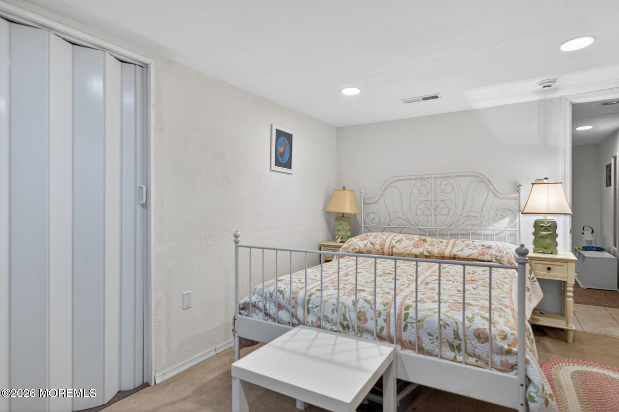 520 Hardenberg Avenue Point Pleasant, NJ 08742 - Photo 15 of 36 a bedroom with a bed and a table