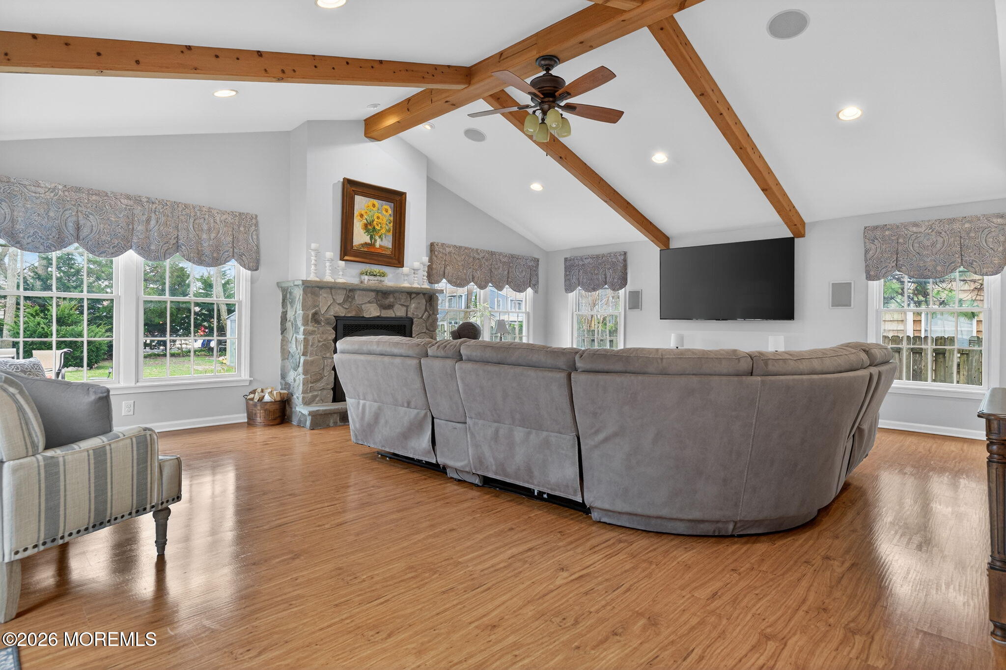 520 Hardenberg Avenue Point Pleasant, NJ 08742 - Photo 26 of 36 a living room with furniture and a flat screen tv