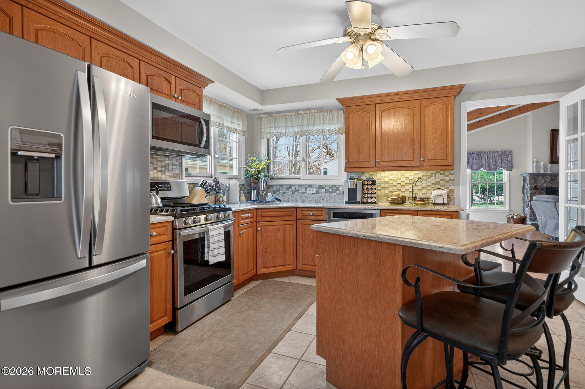 520 Hardenberg Avenue Point Pleasant, NJ 08742 - Photo 5 of 36 a kitchen with stainless steel appliances granite countertop a refrigerator a sink dishwasher a stove and white countertops with wooden floor