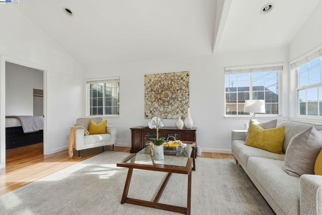 a kitchen with granite countertop a sink stainless steel appliances and cabinets