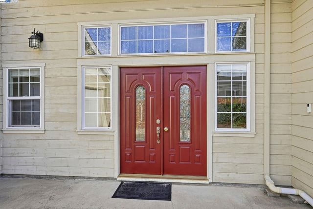 a view of a livingroom with furniture and staircase