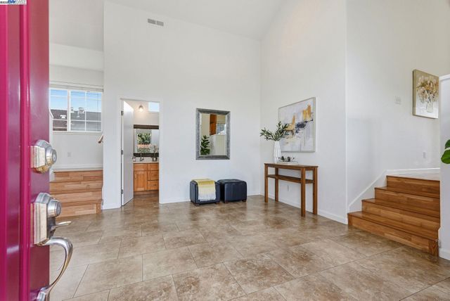 a view of a livingroom with furniture and a potted plant