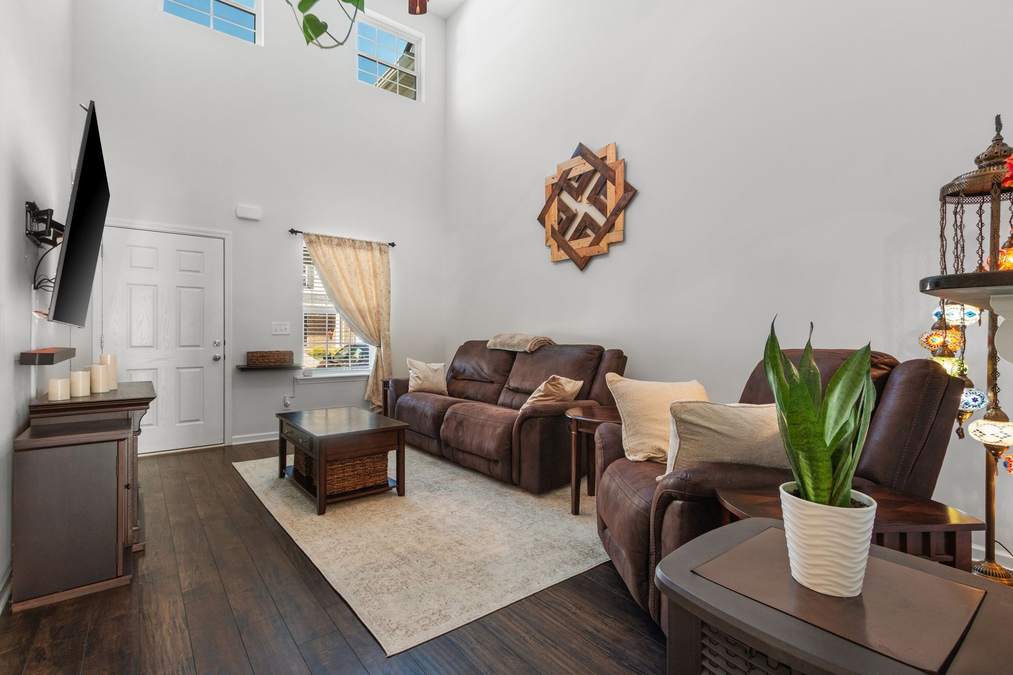 1002 Muna Court Spring Hill, TN 37174 - Photo 11 of 28 a living room with furniture potted plant and a flat screen tv
