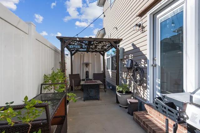 a view of a chairs and table in a patio