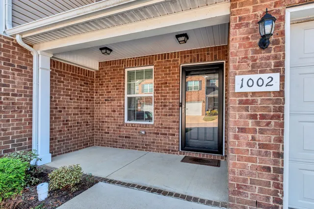a brick building with a door and a window