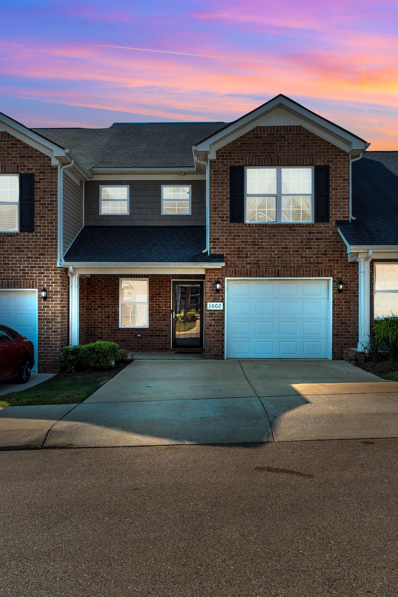 1002 Muna Court Spring Hill, TN 37174 - Photo 4 of 28 a front view of a house with a yard