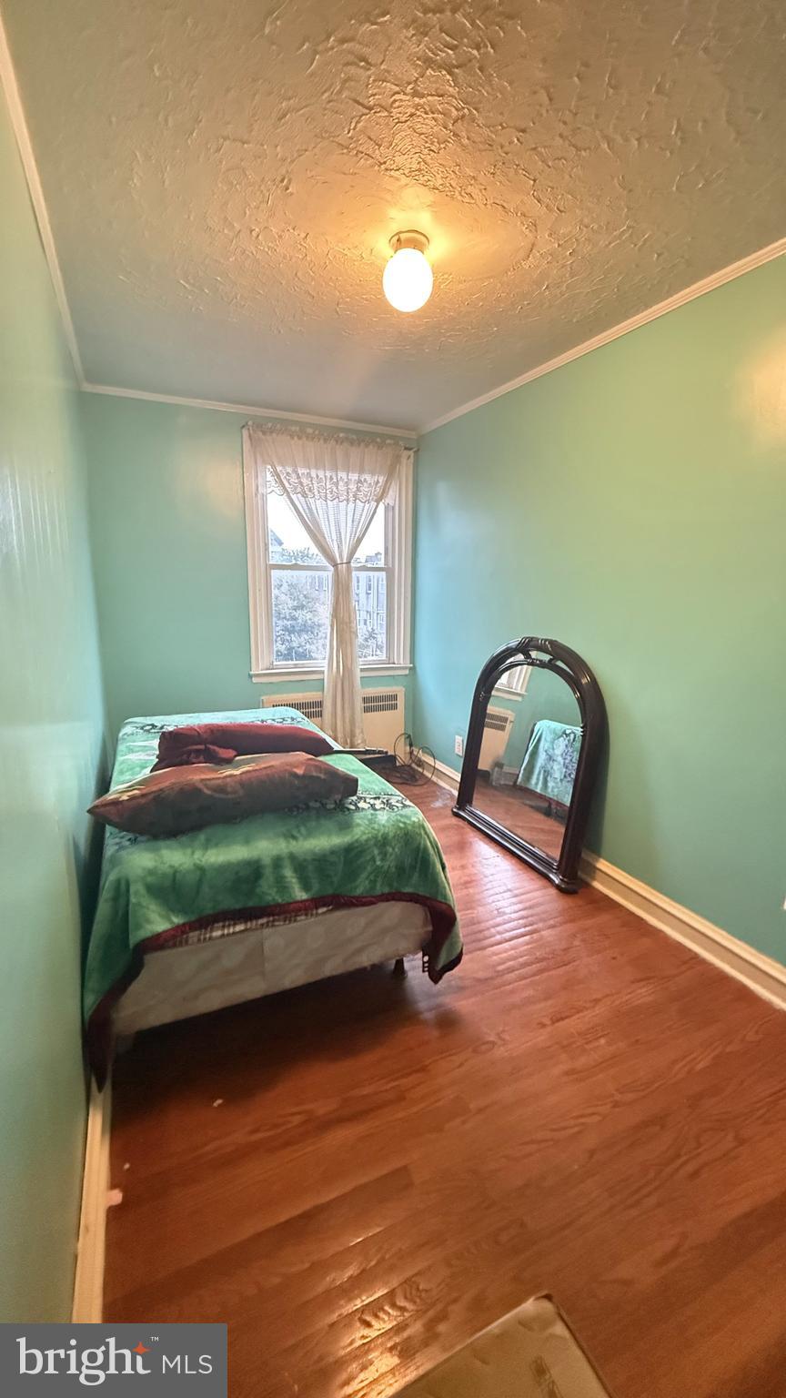 6135 Castor Avenue Philadelphia, PA 19149 - Photo 7 of 44 a bedroom with a bed window and flowerpot