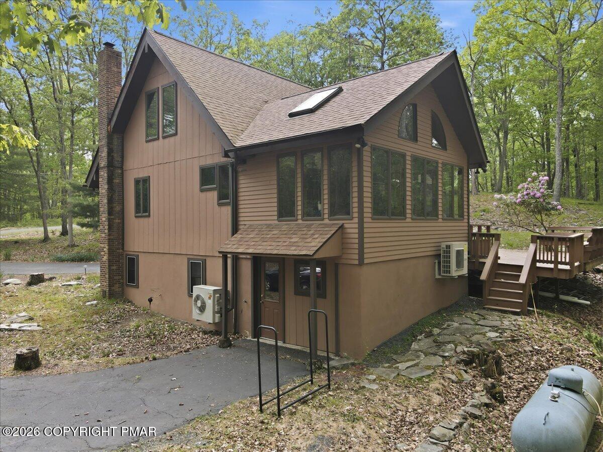 1517 Deer Run East Bushkill, PA 18324 - Photo 35 of 42 a view of a house with a yard and wooden fence