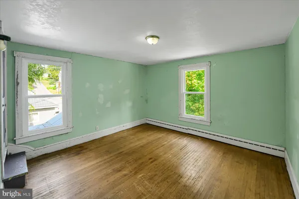 a view of room with window and hardwood floor
