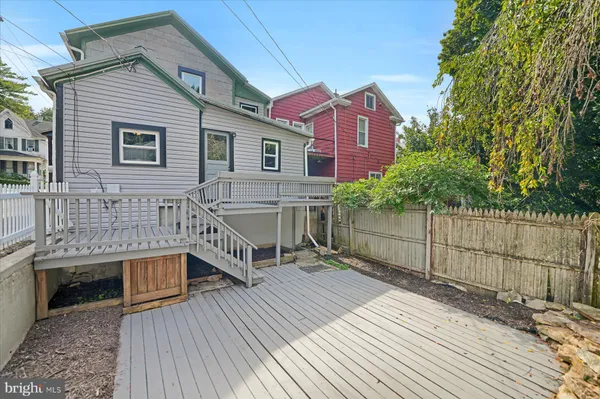 a view of a white house with large windows