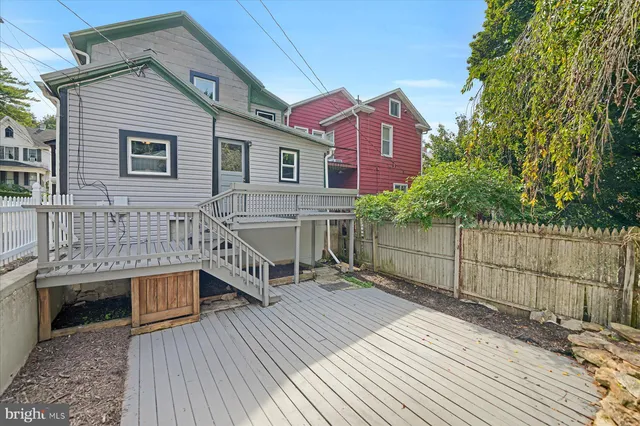 a view of a white house with large windows